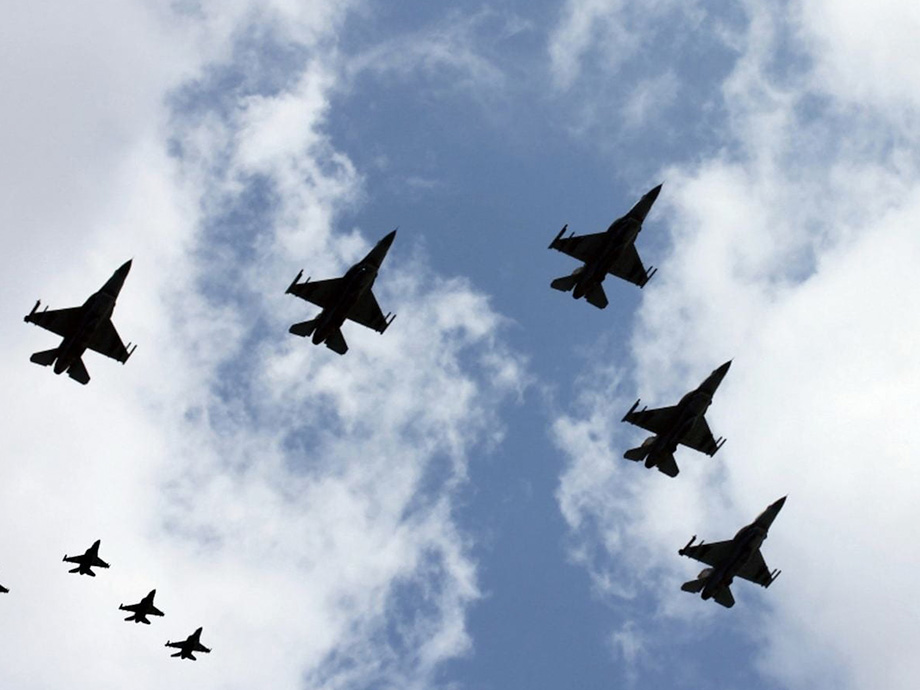 image of fighter jets flying in formation